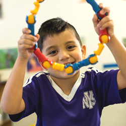 boy holding building blocks