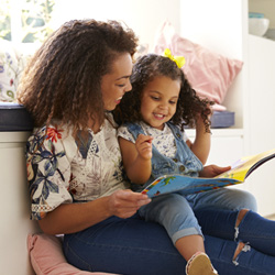 mother reading to daughter