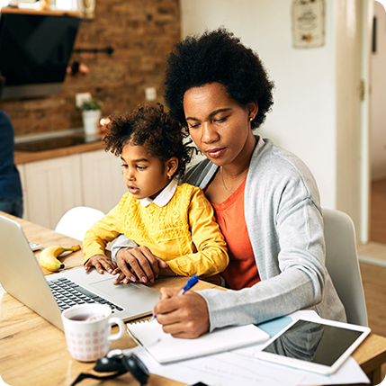 Mom with child on her lap working
