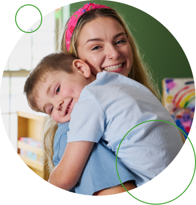 Teacher holding child