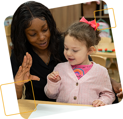 preschool teacher and child doing sign language