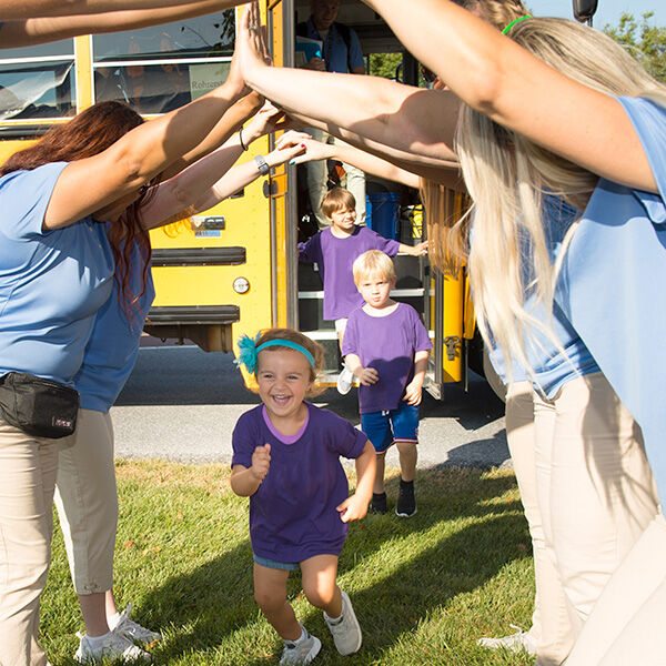 Kids coming off school bus