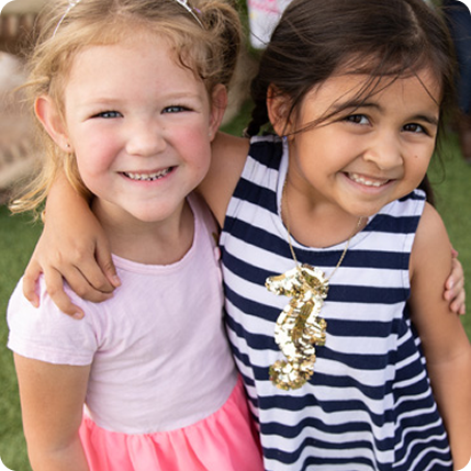 Two girls with arms around each other