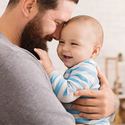 dad holding baby
