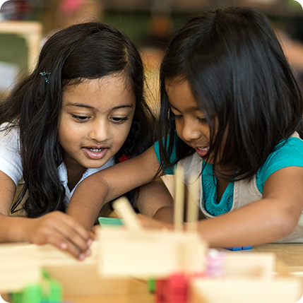 two girls engaged in classroom activity