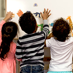 Kids working at easel